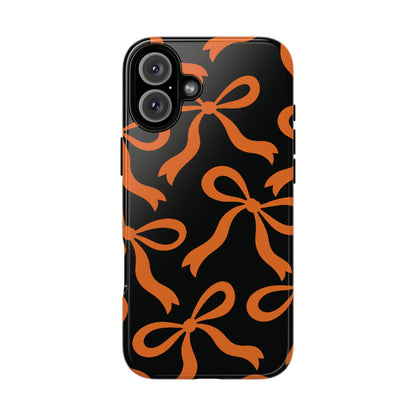 Bold Black and Burnt Orange Bow Pattern Phone Case - Black Phone Case - iPhone 16 Plus / Glossy