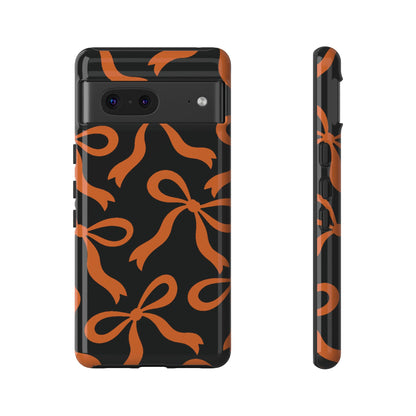 Bold Black and Burnt Orange Bow Pattern Phone Case - Black Phone Case - Google Pixel 7 / Glossy