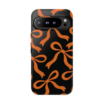 Bold Black and Burnt Orange Bow Pattern Phone Case - Black Phone Case - Google Pixel 9 Pro XL / Glossy