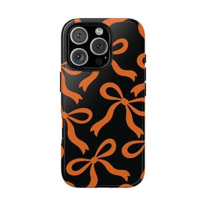 Bold Black and Burnt Orange Bow Pattern Phone Case - Black Phone Case - iPhone 16 Pro / Glossy