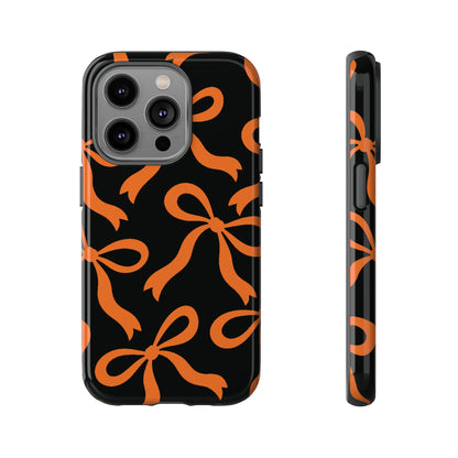 Bold Black and Burnt Orange Bow Pattern Phone Case - Black Phone Case - iPhone 14 Pro / Glossy